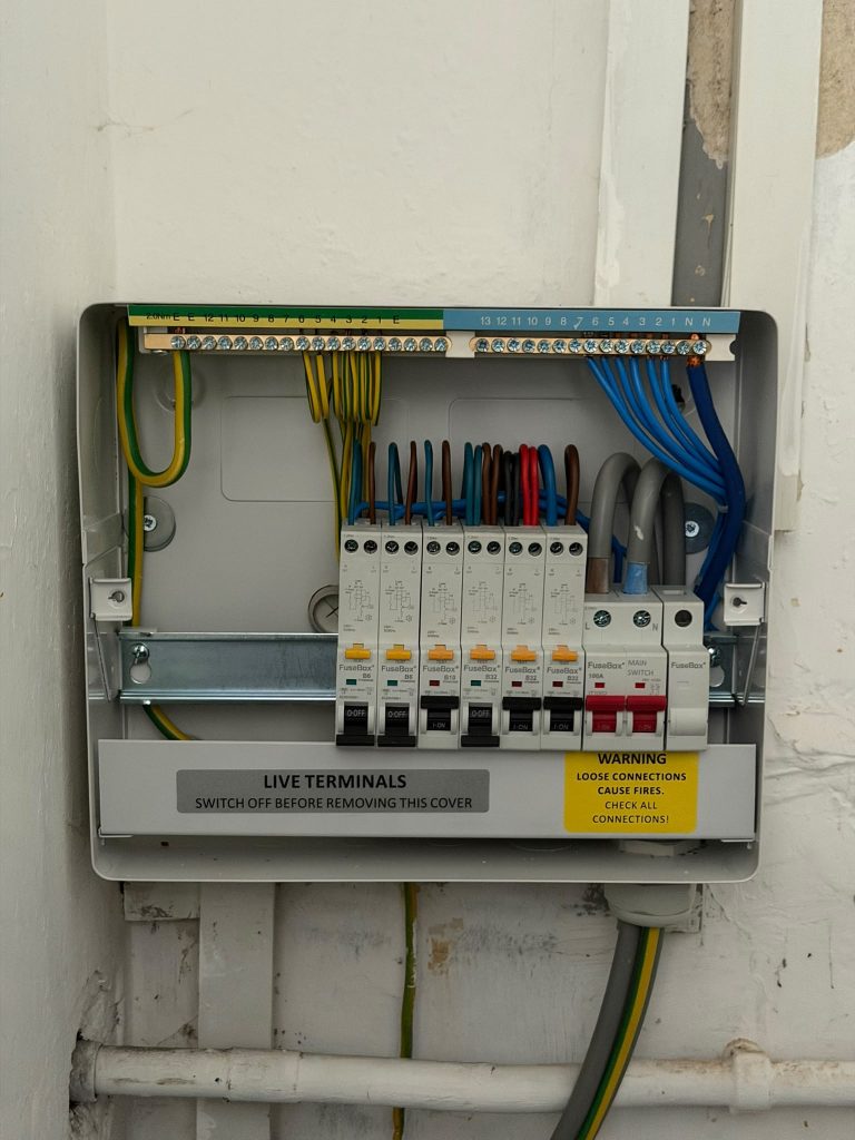 New FuseBox consumer unit with RCBOs and main switch, cover off, on a fuseboard change in Billericay, Essex
